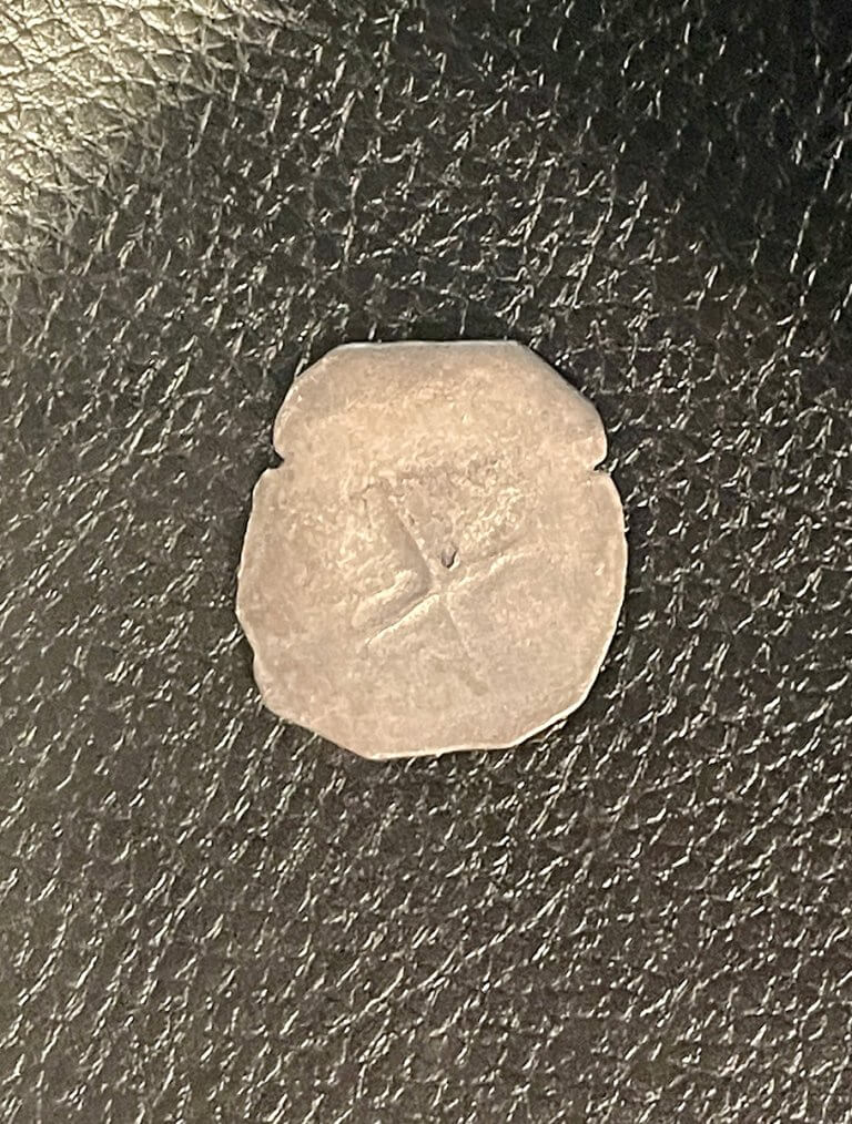 Spanish piece of 8 silver coin photographed with diffused light.