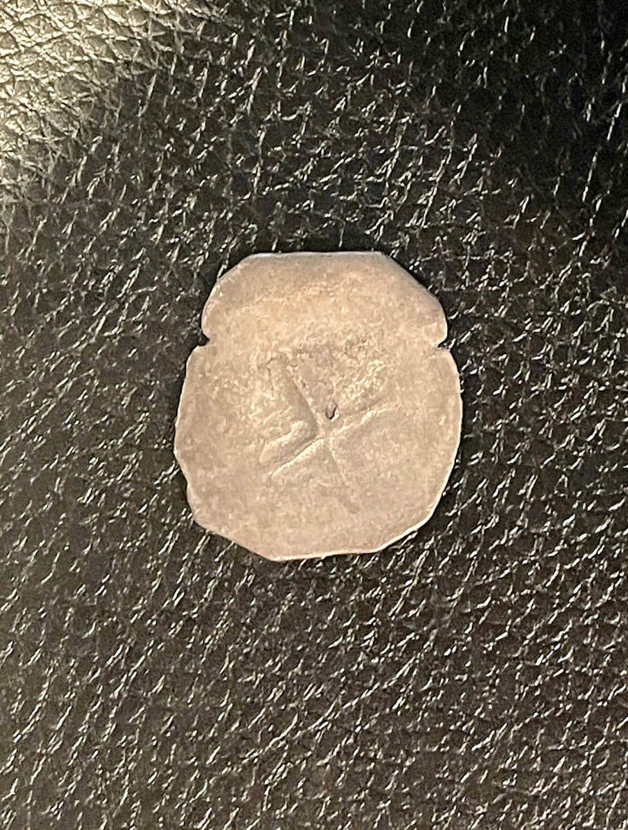 Spanish piece of 8 silver coin photographed with diffused light.