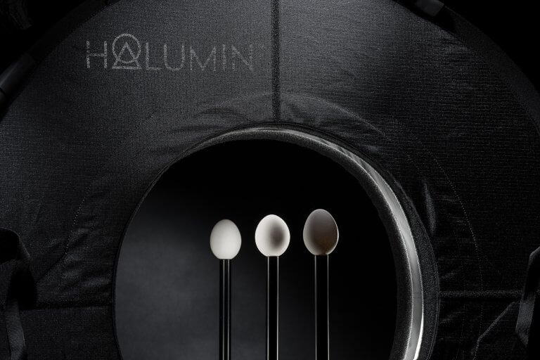 Halumin™'s staging area is the 18" opening in the center of the device. Center stage is defined as the middle of that opening. The mood of the light on the subject can be adjusted by simply moving the artifact upstage and downstage of center stage. In this image, three different styles of light can be viewed at the same time.