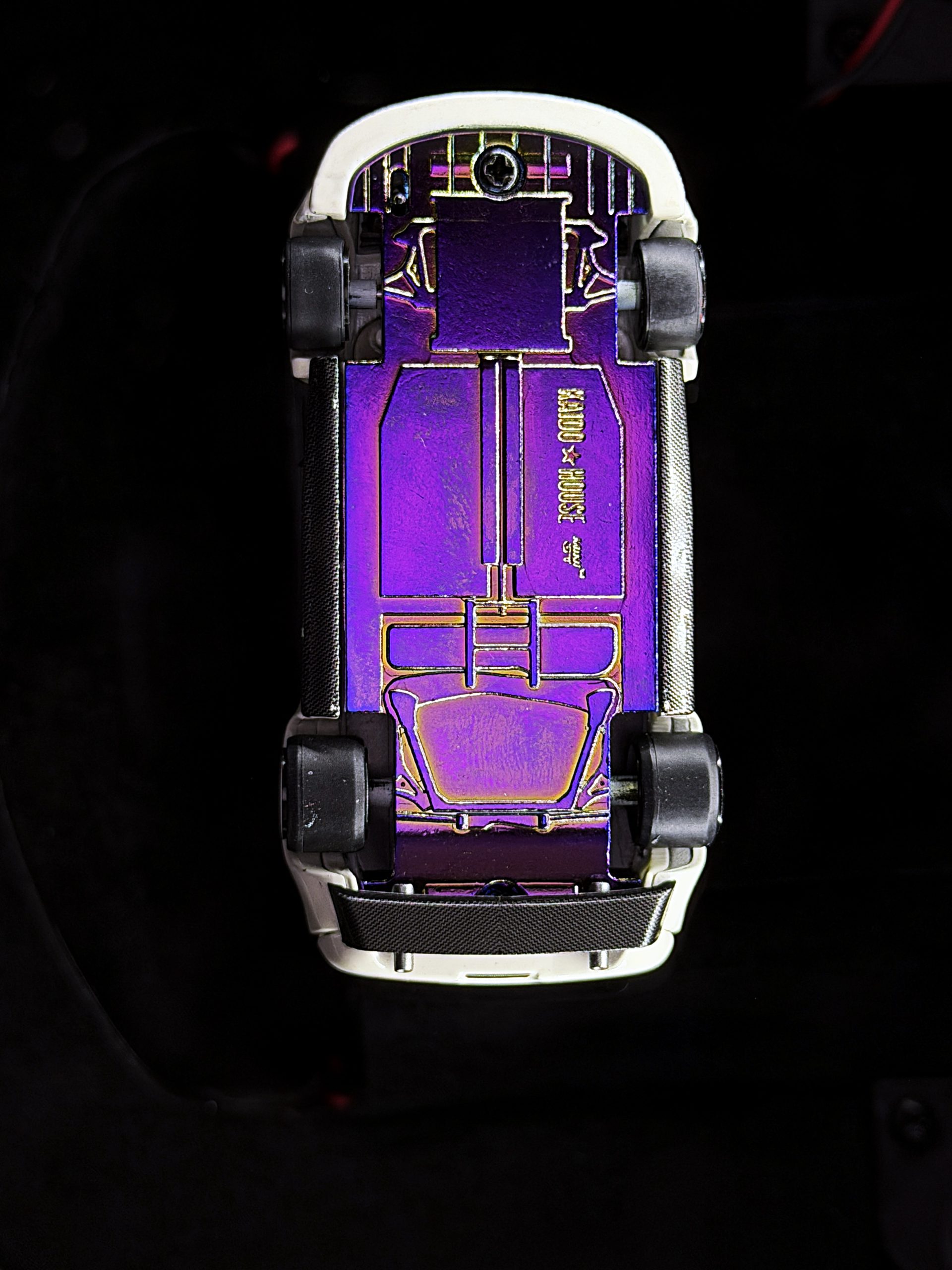 Underside of a white NSX model showing purple opalescent finish under Halumin-C axial lighting