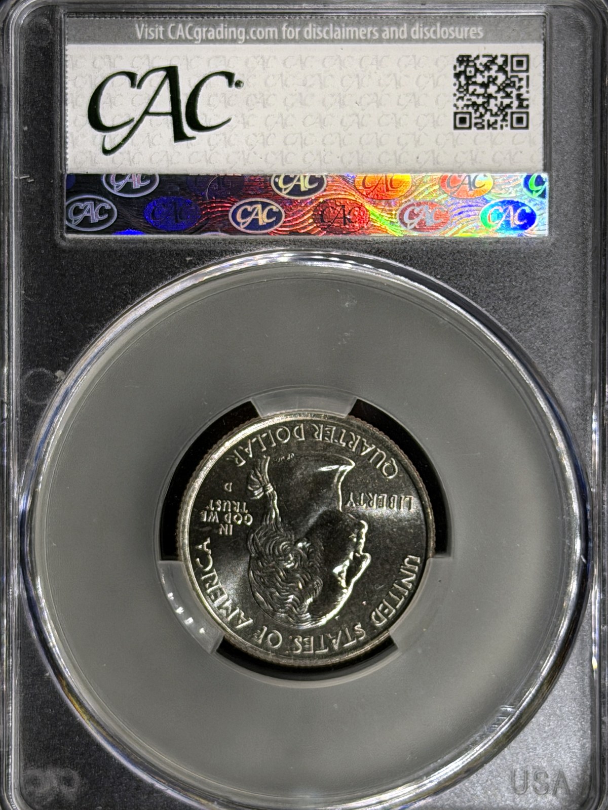American Women quarter in a CAC holder, seen through the back of the holder, showing the obverse with the right-facing George Washington portrait
