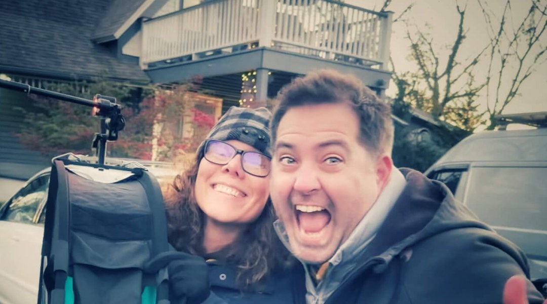 Close-up of Halumin founder Jeremy Mason McGraw and his wife Suraya smiling beside a Halumin lighting device