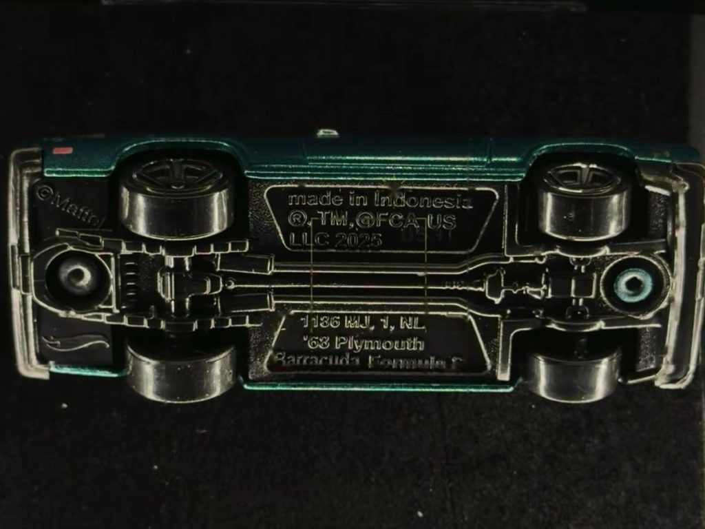 Baseplate of a Hot Wheels '68 Plymouth Barracuda Formula S, lit by Halumin-C, showing the casting name, Mattel and made in Indonesia.