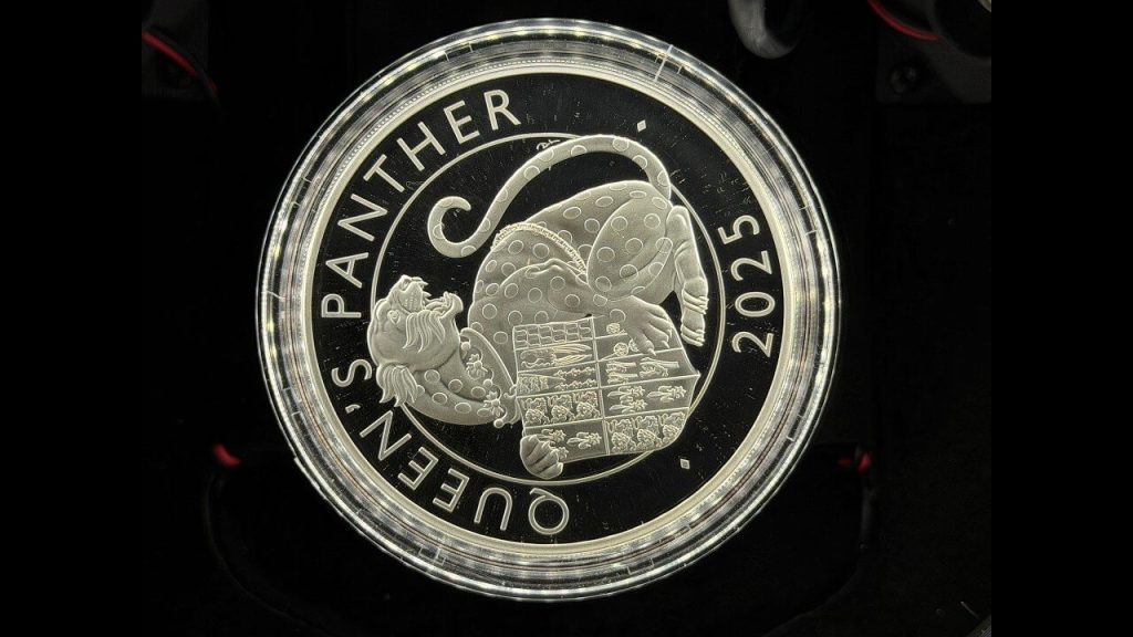 2025 Queen's Panther silver proof coin on a black mirror field, photographed with an iPhone and the Halumin-C