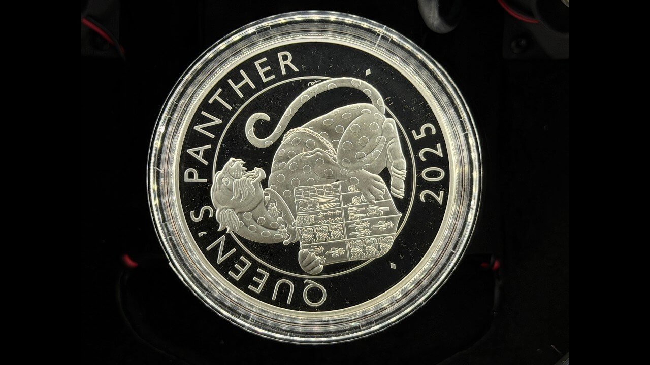 2025 Queen's Panther silver proof coin on a black mirror field, photographed with an iPhone and the Halumin-C