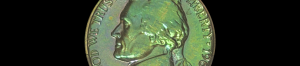 Toned 1963 Jefferson nickel on black, showing natural green and gold toning captured in camera